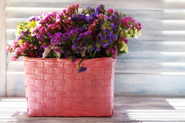 Beautiful flowers in basket — Stock Photo, Image