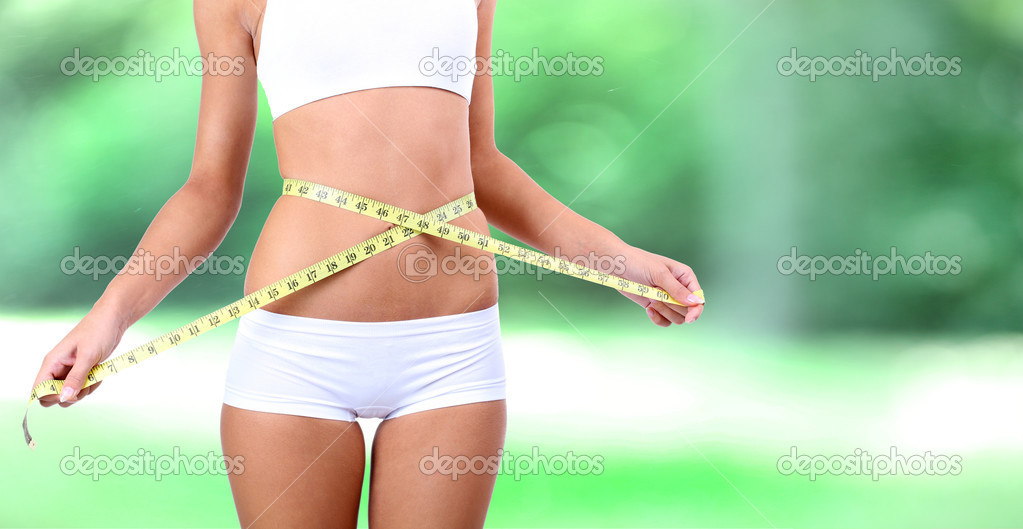 Slim girl with tape on bright background