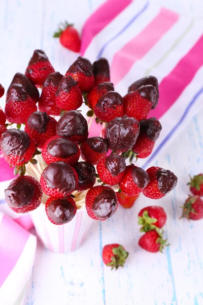 Strawberry in chocolate on skewer — Stock Photo, Image