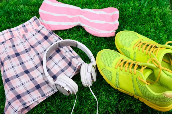 Sport clothes, shoes and headphones — Stock Photo, Image