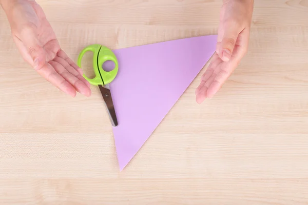 Hands making origami figure — Stock Photo, Image