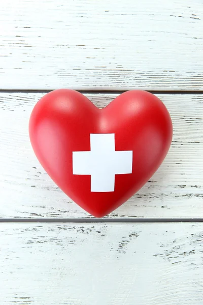 Red heart with cross sign — Stock Photo, Image