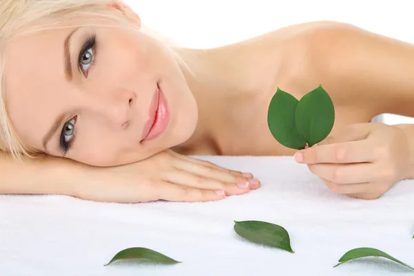 Woman with green leaves — Stock Photo, Image