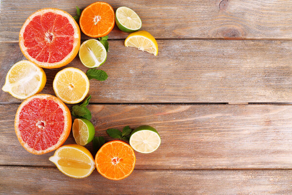 Different sliced juicy citrus fruits