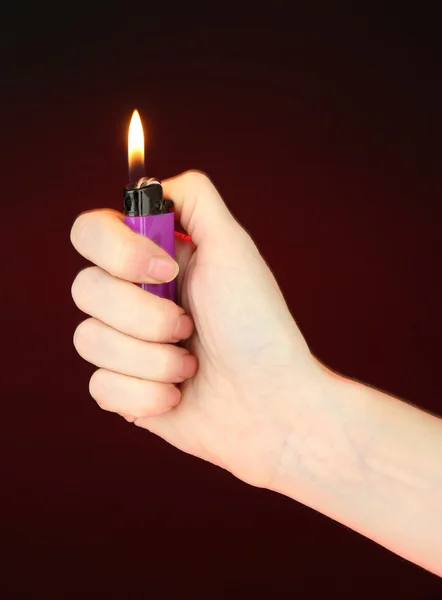 Burning lighter in female hand — Stock Photo, Image