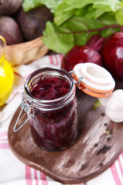 Grated beetroots in jar on table close-up — Stock Photo, Image