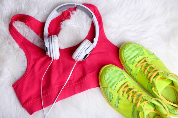 Sport clothes with shoes and headphones