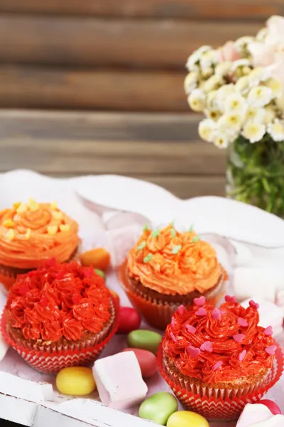 Tasty cupcakes on table — Stock Photo, Image