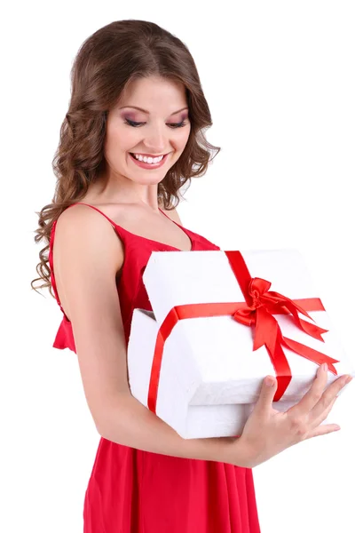 Beautiful young girl in red dress with gift isolated on white — Stock Photo, Image