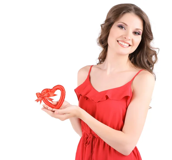 Vacker ung flicka i röd klänning med hjärta isolerad på vit — Stockfoto