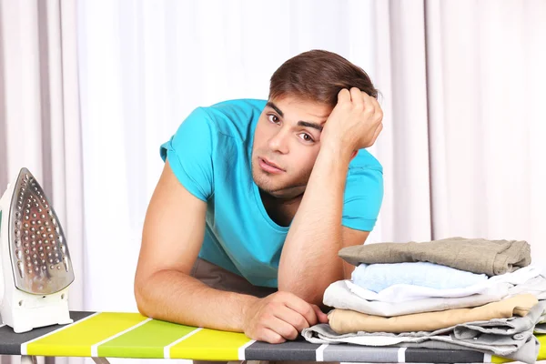 Young man ironing — Stock Photo, Image