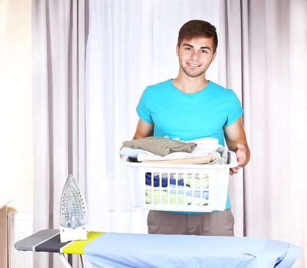 Young man ironing — Stock Photo, Image