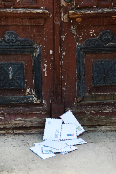 Letters on floor at door — Stock Photo, Image