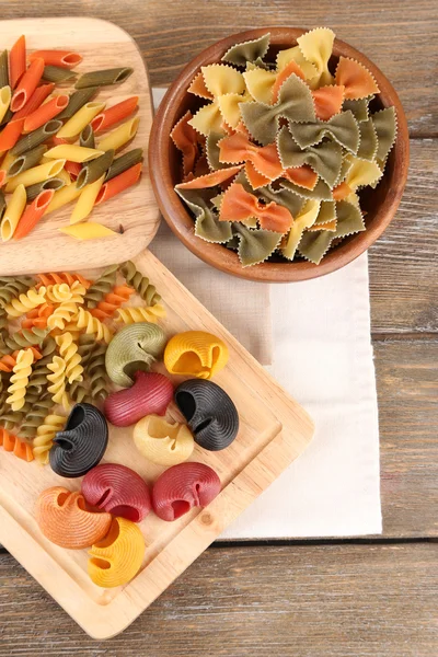 Pasta on wooden background — Stock Photo, Image