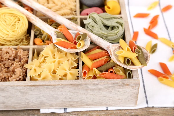 Colorful pasta in wooden box — Stock Photo, Image