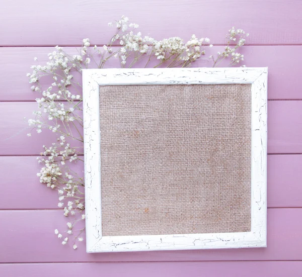 Wooden frame with dried flowers — Stock Photo, Image