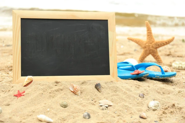 Blank chalkboard on beach — Stock Photo, Image