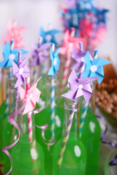 Bottles of drink with straw — Stock Photo, Image