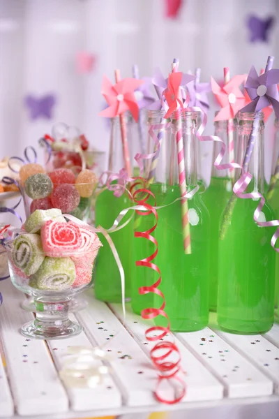 Bottles of drink with straw — Stock Photo, Image