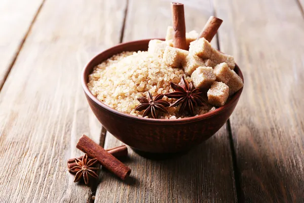 Brown sugar cubes and crystal sugar with spices — Stock Photo, Image