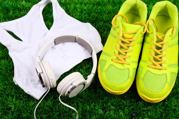 Sport clothes, shoes and headphones