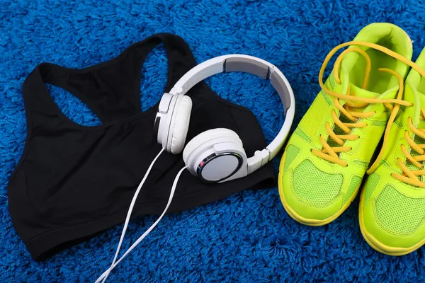 Sport clothes, shoes and headphones — Stock Photo, Image