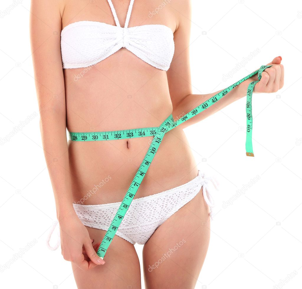 Beautiful woman measuring her body
