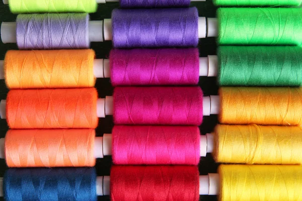 Multicolor sewing threads background — Stock Photo, Image