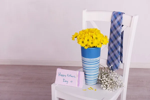 Bouquet of flowers and tie