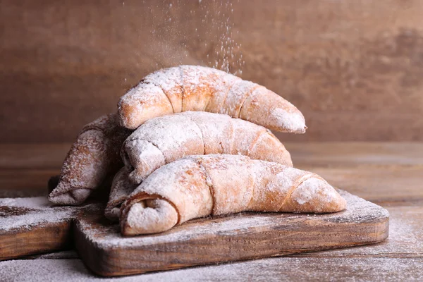 Tasty bagels with sugar powder — Stock Photo, Image