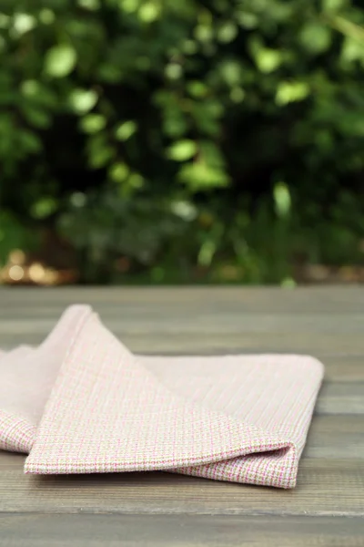 Wooden table with tablecloth — Stock Photo, Image