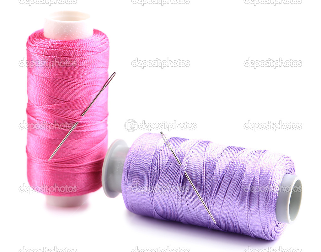 Needles and spools of thread