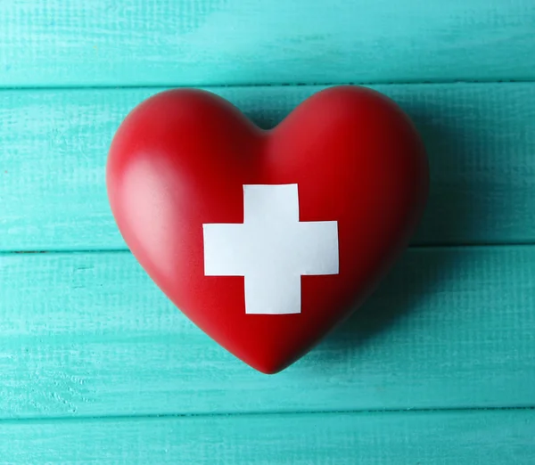 Red heart with cross sign — Stock Photo, Image