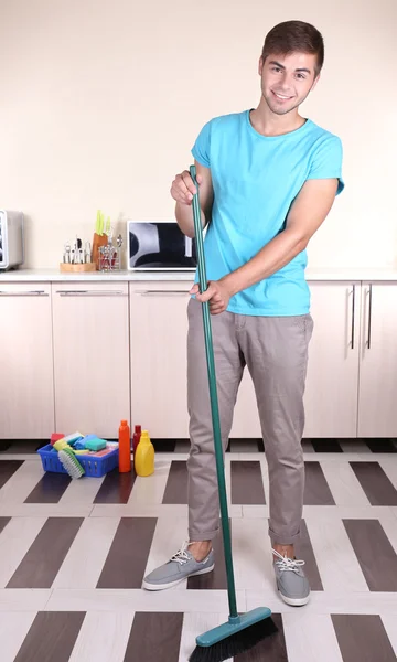 Young man cleaning floor — Stock Photo, Image