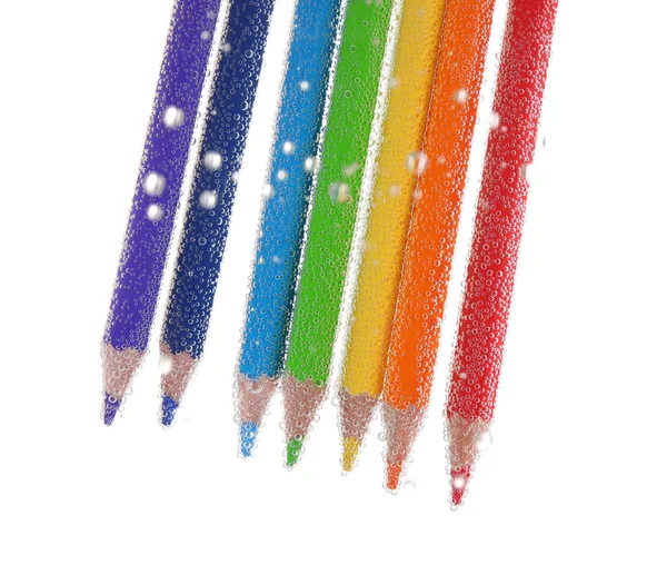 Lápis coloridos em bolhas de água — Fotografia de Stock