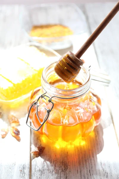 Fresh honey on wooden table — Stock Photo, Image