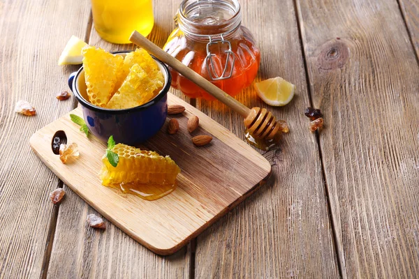 Fresh honey on wooden table — Stock Photo, Image