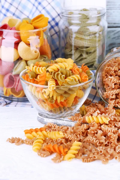 Colorful pasta in glass jars — Stock Photo, Image