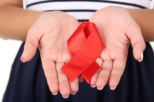 Woman with aids awareness red ribbon — Stock Photo, Image