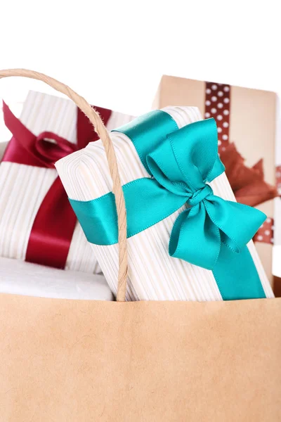 Present boxes in paper bag isolated on white — Stock Photo, Image