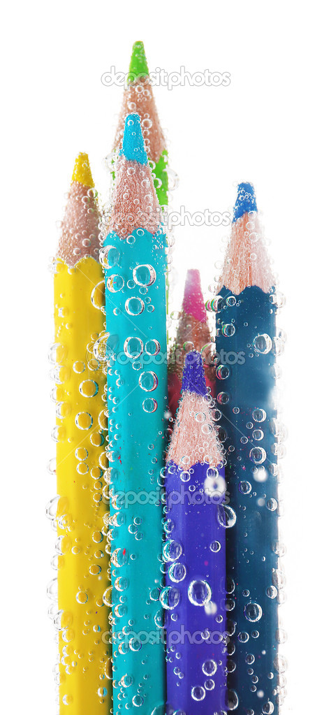 Colorful pencils in water bubbles