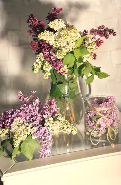 Beautiful lilac flowers in vase — Stock Photo, Image