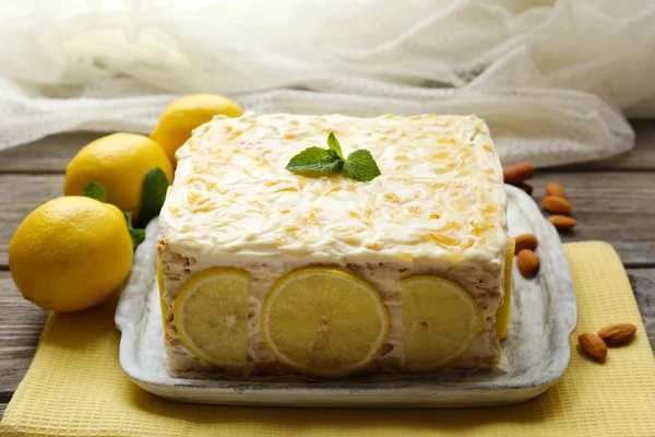 Tasty lemon cake on table at home — Stock Photo, Image