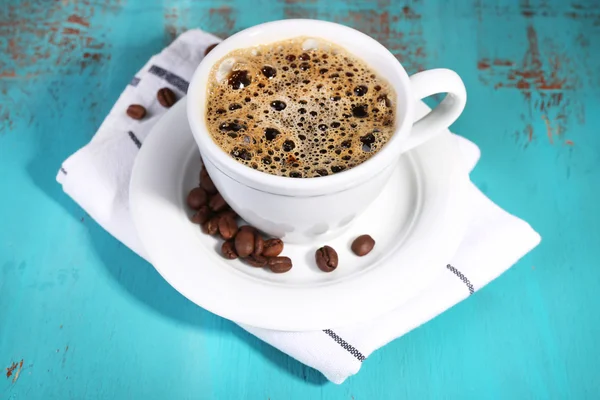 Cup of coffee on color wooden background — Stock Photo, Image