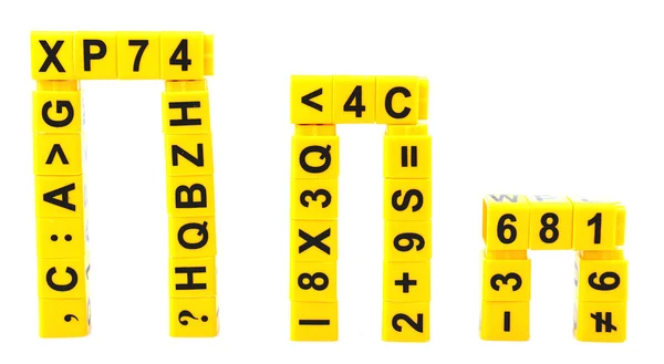 Educatieve kubussen met verschillende cijfers en letters geïsoleerd op wit — Stockfoto