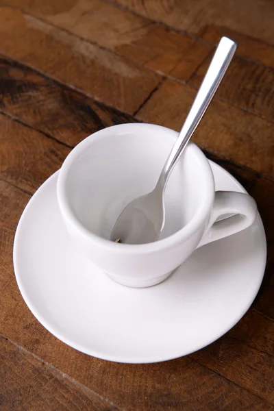 Empty cup with tea spoon — Stock Photo, Image