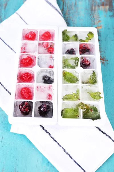 Ice cubes with berries — Stock Photo, Image