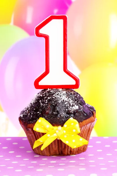 Birthday cupcake with chocolate frosting — Stock Photo, Image