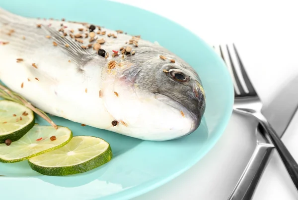 Fish dorado with lemon on plate isolated on white — Stock Photo, Image
