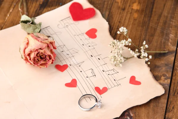 Red paper hearts with dried rose — Stock Photo, Image